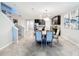 Spacious dining area with a large table and chairs, open to kitchen at 16847 Whisper Elm St, Wimauma, FL 33598