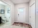 Clean entryway with interior door and half bathroom at 16847 Whisper Elm St, Wimauma, FL 33598