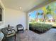 Covered entryway with seating area and view of community at 16847 Whisper Elm St, Wimauma, FL 33598