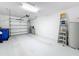 Garage with an automatic door opener and extra storage space at 16847 Whisper Elm St, Wimauma, FL 33598