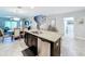 Island kitchen with granite countertops and stainless steel appliances at 16847 Whisper Elm St, Wimauma, FL 33598