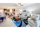 Open living room and kitchen with a large dining table at 16847 Whisper Elm St, Wimauma, FL 33598