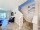 Elegant staircase leading to the upper level of the home at 16847 Whisper Elm St, Wimauma, FL 33598