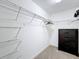 Large walk-in closet with ample shelving and dresser at 16847 Whisper Elm St, Wimauma, FL 33598