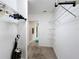 Spacious walk-in closet with wire shelving and hanging rods at 16847 Whisper Elm St, Wimauma, FL 33598