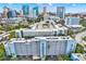 Aerial view of a condo building, highlighting its location amidst other buildings and parking areas at 201 W Laurel St # 308, Tampa, FL 33602