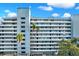 View of the building's exterior, with balconies and landscaping at 201 W Laurel St # 308, Tampa, FL 33602