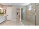 Large walk-in shower and double vanity with walk-in closet at 2311 Overfalls Pl, Wesley Chapel, FL 33543