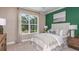 Comfortable bedroom with window and neutral color scheme at 2311 Overfalls Pl, Wesley Chapel, FL 33543