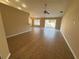 Open living area with tile flooring and access to the patio at 26901 Roseann Pl, Lutz, FL 33559