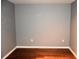 Empty bedroom with hardwood floors and gray walls at 37670 Aaralyn Rd, Zephyrhills, FL 33542