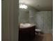 Clean bathroom with single sink vanity, shower, and toilet at 37715 Aaralyn Rd, Zephyrhills, FL 33542