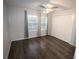 Spacious bedroom with wood-look floors and large closet at 37715 Aaralyn Rd, Zephyrhills, FL 33542