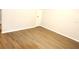Dining area with wood-look floors and a pass-through to the kitchen at 37715 Aaralyn Rd, Zephyrhills, FL 33542