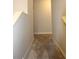 Upstairs hallway with carpeted floors at 37715 Aaralyn Rd, Zephyrhills, FL 33542