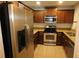 Modern kitchen featuring stainless steel appliances and granite countertops at 37715 Aaralyn Rd, Zephyrhills, FL 33542