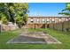 Spacious backyard with a concrete patio and a well-maintained lawn at 408 E Amelia Ave, Tampa, FL 33602