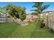 Large backyard with grassy lawn and concrete patio at 408 E Amelia Ave, Tampa, FL 33602