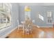 Cozy dining area with natural light, light-blue walls, and a modern pendant lighting fixture at 408 E Amelia Ave, Tampa, FL 33602