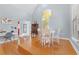 Cozy dining area with hardwood floors, a round table, and white chairs at 408 E Amelia Ave, Tampa, FL 33602
