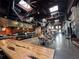 Indoor food hall with long wooden tables at 408 E Amelia Ave, Tampa, FL 33602