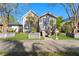 Charming single-story home featuring a quaint front porch, inviting entrance, and well-maintained landscaping at 408 E Amelia Ave, Tampa, FL 33602