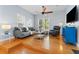 Bright living room featuring hardwood floors, comfortable seating, and a ceiling fan at 408 E Amelia Ave, Tampa, FL 33602