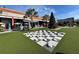 A checkers game in Armature Works outdoor space with the building and tree decor at 408 E Amelia Ave, Tampa, FL 33602