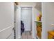 Well-lit hallway with ample storage space and laundry area at 500 Treasure Island Cswy # 307, Treasure Island, FL 33706