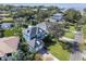 Drone view of waterfront home, showcasing the property's location and landscaping at 5004 W Leona St, Tampa, FL 33629