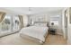 Main bedroom with king-size bed and private access to balcony at 5004 W Leona St, Tampa, FL 33629