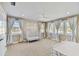 Bedroom featuring neutral colors, white trim, multiple windows, and plush carpet at 5004 W Leona St, Tampa, FL 33629