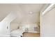Small attic bedroom with a single bed and a nightstand at 5004 W Leona St, Tampa, FL 33629