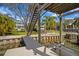 Waterfront property featuring a boat lift, private dock and stairs leading to a rooftop deck with scenic views at 5004 W Leona St, Tampa, FL 33629