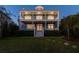 Two story teal home with a large backyard and porch at 5004 W Leona St, Tampa, FL 33629
