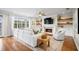 Cozy living room boasts a fireplace, built-in shelving, and a large window with backyard views at 5004 W Leona St, Tampa, FL 33629
