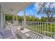 Covered porch overlooks a lush backyard with a sprawling lawn at 5004 W Leona St, Tampa, FL 33629