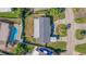 Aerial view showing home, pool, and driveway at 5201 40Th S St, St Petersburg, FL 33711