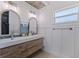 Updated bathroom with double vanity and wood cabinets at 5201 40Th S St, St Petersburg, FL 33711