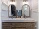 Modern bathroom with double vanity and elegant mirrors at 5201 40Th S St, St Petersburg, FL 33711