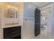 Stylish bathroom with a modern vanity and arched mirror at 5201 40Th S St, St Petersburg, FL 33711
