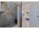 Spa-like bathroom with marble shower and built-in shelving at 5201 40Th S St, St Petersburg, FL 33711