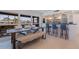 Open concept dining area with farmhouse table and kitchen view at 5201 40Th S St, St Petersburg, FL 33711