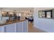 Open concept dining area with farmhouse table and kitchen view at 5201 40Th S St, St Petersburg, FL 33711