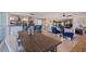 Open concept dining area with farmhouse table and kitchen view at 5201 40Th S St, St Petersburg, FL 33711