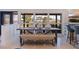 Bright dining area with farmhouse table, bench, and view to backyard at 5201 40Th S St, St Petersburg, FL 33711