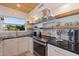 Modern kitchen with stainless steel appliances and wood shelving at 5201 40Th S St, St Petersburg, FL 33711