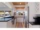 Modern kitchen with white cabinets, granite counters, and wood ceiling at 5201 40Th S St, St Petersburg, FL 33711