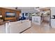 Open concept living area with kitchen and wood feature wall at 5201 40Th S St, St Petersburg, FL 33711