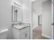 Modern bathroom with granite countertop and white cabinets at 670 16Th S Ave, St Petersburg, FL 33701